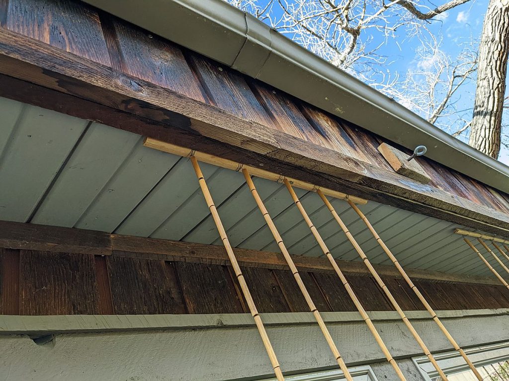 Ruth Swenson's adaptation of Acopian BirdSavers at her house near Helena, Montana makes use of a repurposed bamboo curtain instead of parachute cord.